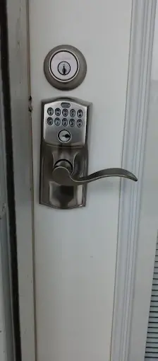 Keypad door lock with a handle, highlighting advanced locksmith services for modern home security